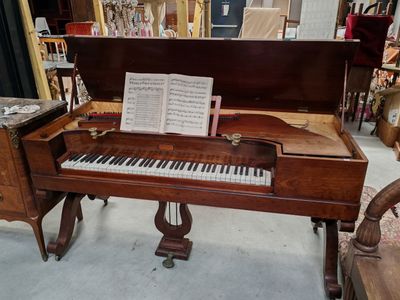 a piano that is sitting in the middle of a room
