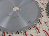 a circular saw blade laying on top of a piece of paper