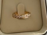 a ring in a box with a price tag on it