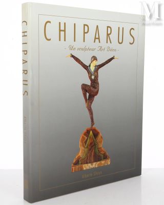 a book with a statue of a woman on a rock
