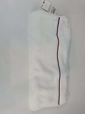 the white towel has a red stripe on the side of it