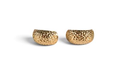 the gold plated earrings are designed to look like a shell