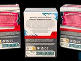 three boxes of cigarettes sitting next to each other on a black surface