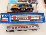 two toy trains sitting next to each other on a table