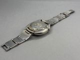an image of a wrist watch on a table with a white background