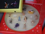 a box with a bunch of small figurines inside of it
