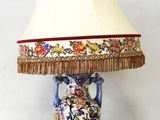 a lamp that is sitting on a table with a lamp shade on it