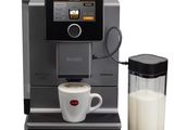 an image of a coffee machine with a glass of milk