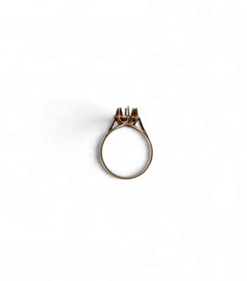 a close up of a ring on a white surface
