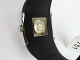 a person holding a smart watch on a white surface