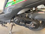 a close up of a motorcycle with a chain attached to it