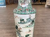 a vase that is sitting on a table in a room
