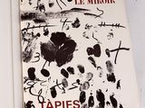 une photo d'un livre sur lequel figure l'image d'un tableau
