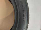a close up of a tire on a white surface