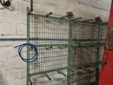 a metal rack with a hose on it in a garage