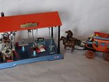 a small model of a horse drawn carriage and a small model of a horse drawn carriage