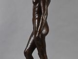 an image of a statue of a woman standing on a wooden base