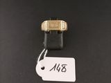 a close up of a gold ring with a tag on it