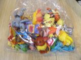 a lot of small plastic toys in a bag on a table