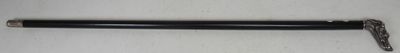 a close up of a black pen on a white surface