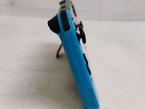 a blue nintendo wii controller sitting on a white surface