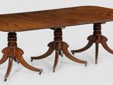 une image représentant une table à trois pieds avec un plateau en bois