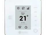 une image représentant un thermostat blanc sur lequel figure une horloge
