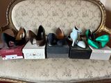 several pairs of women ' s shoes are lined up on a chair