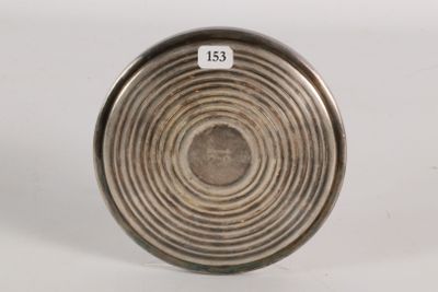 an image of a close up of a metal object on a white surface
