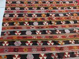 a large rug on the floor next to a bed