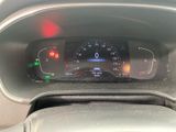 a car dashboard with a speedometer and a clock on it