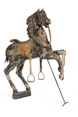 a statue of a horse that is standing on a stand