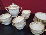 a lot of cups and saucers on the table