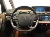 the interior of a car with a steering wheel and dashboard controls