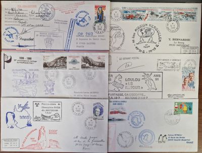 several different stamps and stamps are on a table with a pen