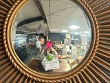 a mirror that is on the wall of a store