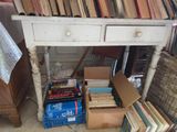 a table with a bunch of books on top of it