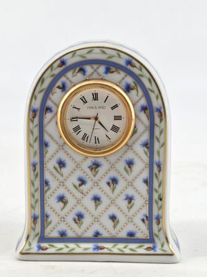 a small clock that is sitting on a table
