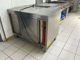 a kitchen with a sink and a stove in it