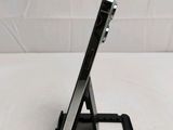 a cell phone that is sitting on a stand