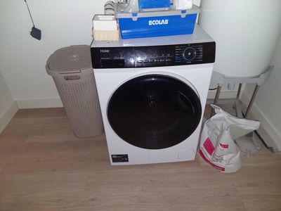 an image of a washer and dryer in a small room