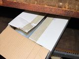 a cardboard box sitting on top of a wooden table