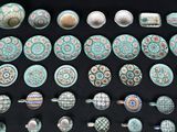 many different types of pottery on display on a table