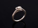 an engagement ring with a pear shaped diamond set in white gold