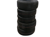 several tires stacked on top of each other on a white background