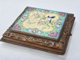 an image of a wooden box with a decorative design on it