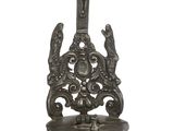 a silver urn with a cross on top of it