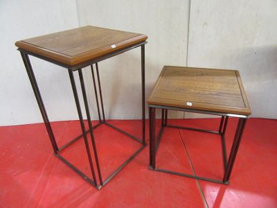 two tables that are sitting on a red floor
