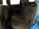 the back seats of a blue car with a black seat belt