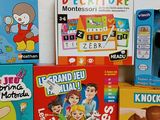 several children ' s board games are sitting on a table next to each other